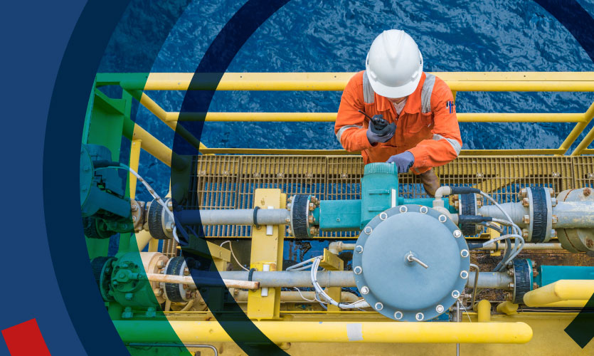 Man working on oil refinery at sea