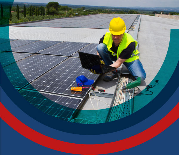 Man installing solar panels on roof